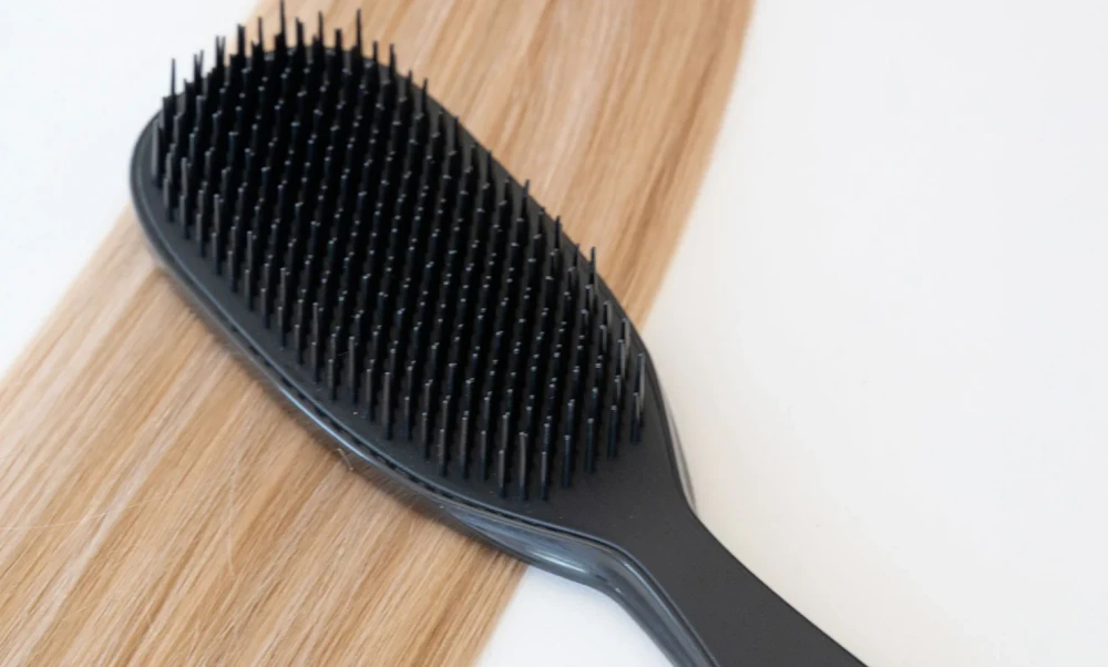 How to Care for Hand-Tied Extensions? 2 brushing hand tied hair extensions