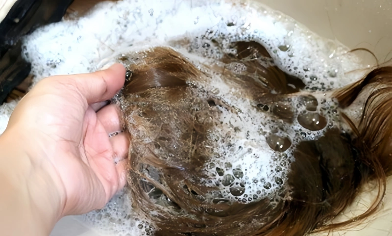 wetting hair extension with lukewarm water hair