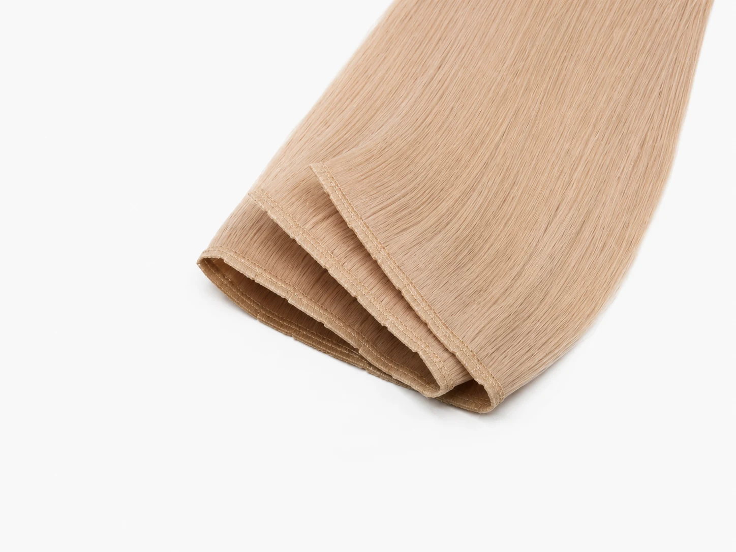 Butterfly weft hair extensions supplied by Alpha Hair Extension, ultra-thin hand-tied weft for flat invisible install