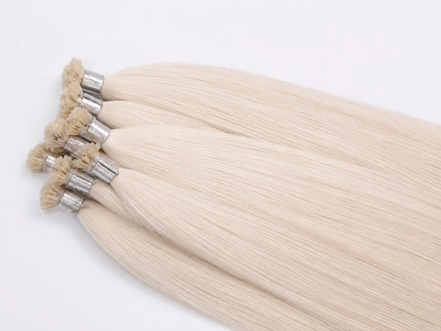 Flat tip keratin fusion hair extensions supplied by Alpha Hair Extension, flat pre-bonded tip for invisible strand-by-strand attachment